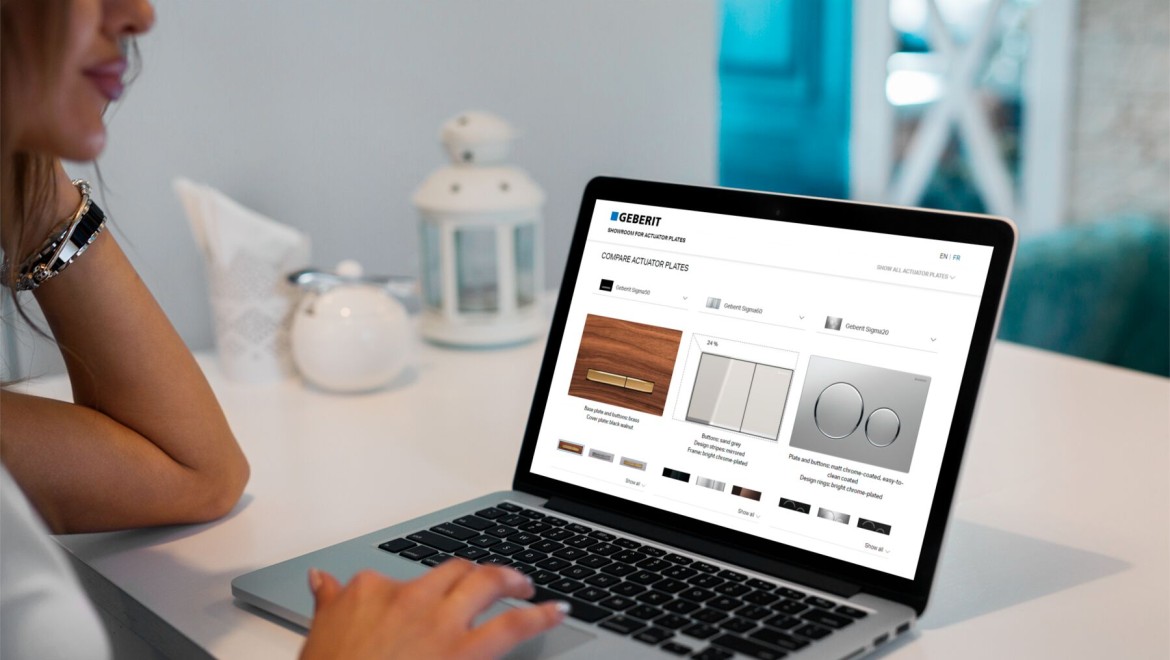 Woman launches the Geberit flush plate showroom on her laptop Woman launches the Geberit flush plate showroom on her laptop
