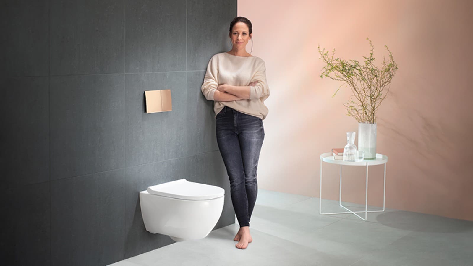 Satisfied woman next to her Geberit Sigma70 Satisfied woman next to her Geberit Sigma70